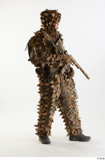 Frtankie Perry Standing with Gun in Ghillie holding gun standing…